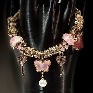 Elegant Pink and Gold Charm Bracelet